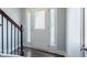 Welcoming entryway with a frosted glass door, sidelights, and dark laminate flooring at 108 Spring View Br, Dallas, GA 30157