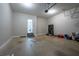Spacious two-car garage with ample storage space, shelving, and an access door to the backyard at 108 Spring View Br, Dallas, GA 30157