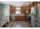 Well-equipped kitchen with stainless steel appliances, ample cabinets, and stylish backsplash and fixtures at 108 Spring View Br, Dallas, GA 30157