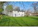 A sprawling backyard with beautiful green grass and home with white siding at 2703 Flagstone Dr, Atlanta, GA 30316