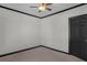 Comfortable bedroom with neutral carpet, ceiling fan and contrasting black trim at 391 S Bend Se Ave, Atlanta, GA 30315
