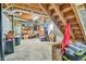 Unfinished basement with exposed ceiling, storage, stairs, and concrete floor at 5774 Harbor Dr, Buford, GA 30518