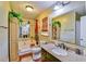 Bathroom featuring a soaking tub, granite countertop vanity, and stylish decor at 5774 Harbor Dr, Buford, GA 30518
