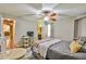 Comfortable bedroom with large bed, desk, and window with natural light at 5774 Harbor Dr, Buford, GA 30518