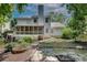 Spacious backyard featuring stone patio areas and an established garden, perfect for outdoor entertaining at 2429 Brookgreen Nw Commons, Kennesaw, GA 30144