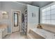 Relaxing bathroom features a soaking tub, a separate shower, and a vanity with generous counter space at 2429 Brookgreen Nw Commons, Kennesaw, GA 30144
