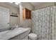 Bathroom featuring a toilet, sink with marble top, and a shower behind a patterned curtain at 2429 Brookgreen Nw Commons, Kennesaw, GA 30144