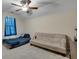 Bedroom area with neutral walls, a ceiling fan, and a window with blinds at 2429 Brookgreen Nw Commons, Kennesaw, GA 30144