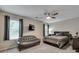 Bedroom with hardwood floors, a ceiling fan, and two windows with blinds at 2429 Brookgreen Nw Commons, Kennesaw, GA 30144