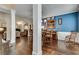 Elegant dining room with hardwood floors, a piano, and a stylish blue accent wall for sophisticated gatherings at 2429 Brookgreen Nw Commons, Kennesaw, GA 30144