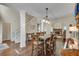 Bright dining space boasting hardwood floors, a central table, and seamless connection to the living area at 2429 Brookgreen Nw Commons, Kennesaw, GA 30144