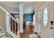Welcoming entryway featuring an elegant front door and hardwood flooring that leads into an open floor plan at 2429 Brookgreen Nw Commons, Kennesaw, GA 30144