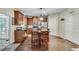 Open kitchen with wood cabinets, stainless steel appliances and a central island perfect for dining at 2429 Brookgreen Nw Commons, Kennesaw, GA 30144