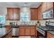 Well-equipped kitchen with a gas range and stainless steel appliances, complemented by granite countertops at 2429 Brookgreen Nw Commons, Kennesaw, GA 30144