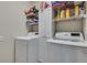 Convenient laundry room with washer, dryer, storage cabinets and shelving to keep organized at 2429 Brookgreen Nw Commons, Kennesaw, GA 30144