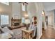 Spacious living room showing a stone fireplace, hardwood floors, and an archway to the kitchen at 2429 Brookgreen Nw Commons, Kennesaw, GA 30144