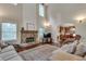 Open-concept living area showcasing a stone fireplace and seamless transition into the well-equipped kitchen at 2429 Brookgreen Nw Commons, Kennesaw, GA 30144