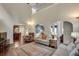 Open-concept living room leading to the kitchen, featuring hardwood floors and a comfortable seating arrangement at 2429 Brookgreen Nw Commons, Kennesaw, GA 30144
