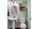 Cozy powder room with pedestal sink, decorative accents, and a charming vintage-inspired design at 2429 Brookgreen Nw Commons, Kennesaw, GA 30144
