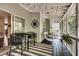 Charming screened porch with string lights, stylish furniture, and a relaxing atmosphere at 2429 Brookgreen Nw Commons, Kennesaw, GA 30144