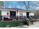 Spacious backyard deck features lounge seating, an outdoor heater and room for entertaining at 3236 Jonesboro Rd, Atlanta, GA 30354