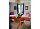 Bright and airy bedroom with two beds, stylish decor, and ample natural light at 3236 Jonesboro Rd, Atlanta, GA 30354