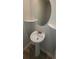 Powder room featuring a pedestal sink with decorative fixtures and corner shelves at 3484 Enterkin Ln, Atlanta, GA 30349