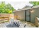 Charming back porch, perfect for outdoor dining and relaxation with surrounding greenery at 299 Fletcher Sw St, Atlanta, GA 30315