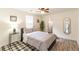 Cozy bedroom with neutral tones, hardwood floors, decorative rug, and large windows for ample natural light at 299 Fletcher Sw St, Atlanta, GA 30315