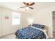 Bright bedroom features a ceiling fan, window, and luxury vinyl plank flooring at 299 Fletcher Sw St, Atlanta, GA 30315