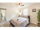 Bright bedroom features a ceiling fan, neutral walls, and luxury vinyl plank flooring at 299 Fletcher Sw St, Atlanta, GA 30315