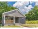 A delightful single-Gathering house features a newly renovated facade, front porch, and well-manicured lawn at 299 Fletcher Sw St, Atlanta, GA 30315