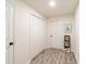 Hallway features closet, white doors, luxury vinyl plank flooring and neutral walls at 299 Fletcher Sw St, Atlanta, GA 30315