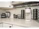 Bright kitchen counter with stainless steel appliances and organized accessories at 299 Fletcher Sw St, Atlanta, GA 30315