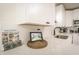Beautiful kitchen with stylish white counters, sink, cabinets, and a decorative backsplash at 299 Fletcher Sw St, Atlanta, GA 30315