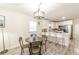 Open-concept kitchen with white cabinets, modern appliances, and breakfast bar seating at 299 Fletcher Sw St, Atlanta, GA 30315