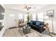 A bright and airy living room boasts stylish decor with a plush sofa, accent chair, and ample natural light at 299 Fletcher Sw St, Atlanta, GA 30315