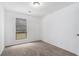 Cozy bedroom featuring neutral carpet, a bright window, and fresh white walls at 5444 Wylstream, Norcross, GA 30093
