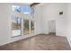 Sunlit living room with high ceilings, large windows, and hardwood floors at 5444 Wylstream, Norcross, GA 30093