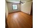 Bedroom with hardwood floors, ceiling fan, window, and neutral walls at 1024 Magnolia Dr, Smyrna, GA 30082