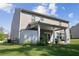 A view of the home's backyard and patio area on a sunny day at 450 Noblewood Dr, Mcdonough, GA 30252