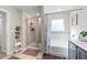 Full bathroom featuring a tub and shower combination with gray cabinets and shelves at 450 Noblewood Dr, Mcdonough, GA 30252