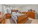 Traditional bedroom with decorative wood bed frame, matching dressers, neutral carpet, and natural light at 450 Noblewood Dr, Mcdonough, GA 30252