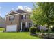 Inviting two-story house with brick facade, attached garage, and lush green lawn at 450 Noblewood Dr, Mcdonough, GA 30252