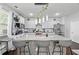 Bright kitchen featuring a large island with seating, stainless steel appliances, and ample cabinet space at 450 Noblewood Dr, Mcdonough, GA 30252