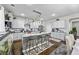 Well-lit kitchen with a center island, stainless steel appliances, and light gray cabinets for a modern feel at 450 Noblewood Dr, Mcdonough, GA 30252