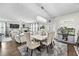 Spacious open-concept living area with hardwood floors, a dining area, and lots of natural light at 450 Noblewood Dr, Mcdonough, GA 30252
