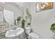 Stylish powder room with a modern sink, decorative mirror, and neutral color scheme at 450 Noblewood Dr, Mcdonough, GA 30252