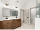 Stylish bathroom with double sink vanity and large mirror at 5125 Hyde Trl, Cumming, GA 30040