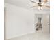 Spacious bedroom features a ceiling fan and view to the second story hallway at 5125 Hyde Trl, Cumming, GA 30040